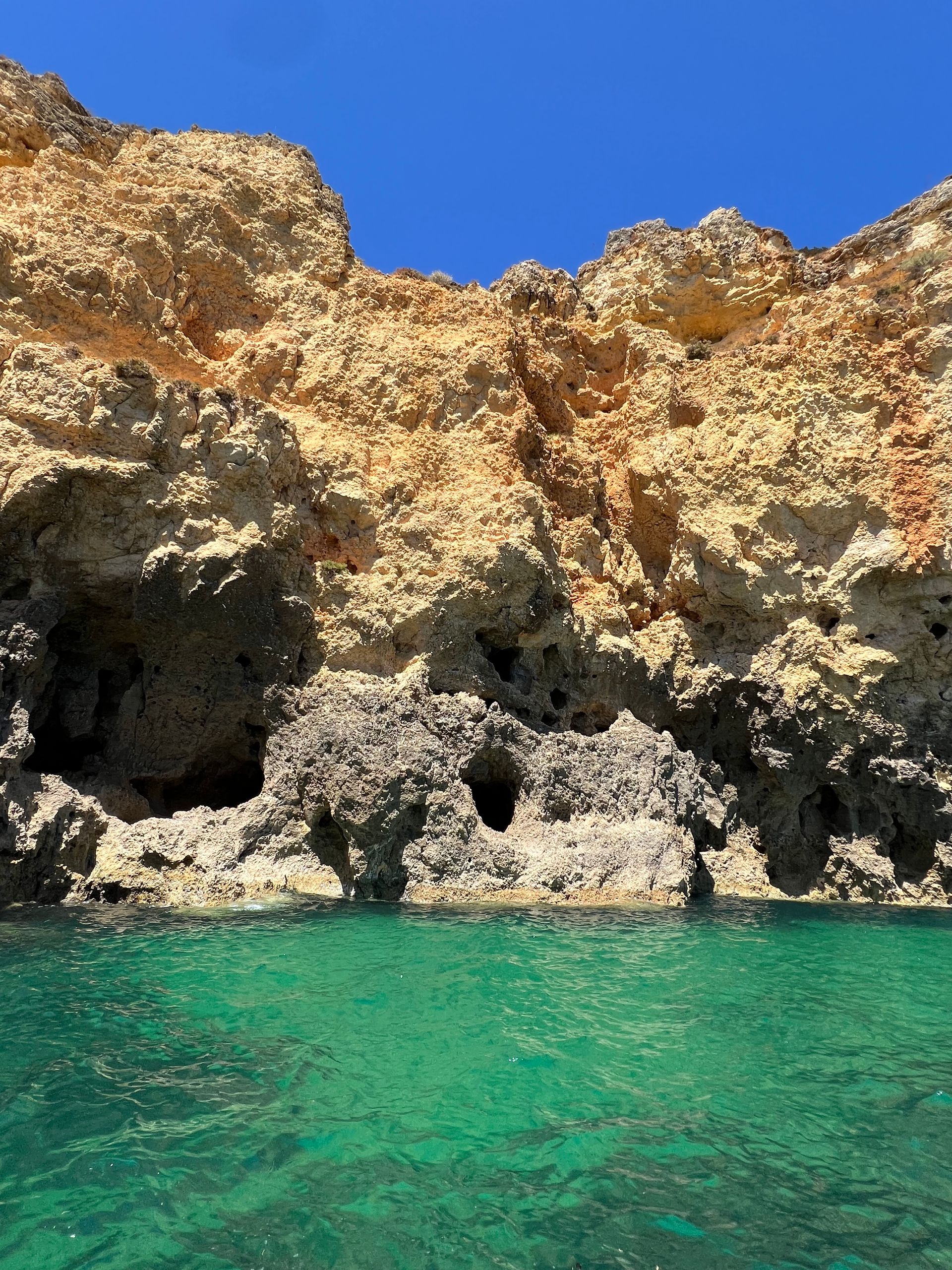 Golden cliffs and turquoise water near Lagos